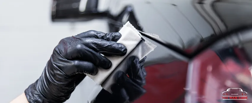 TMC - A person applying a layer of nano-ceramic coating on a car